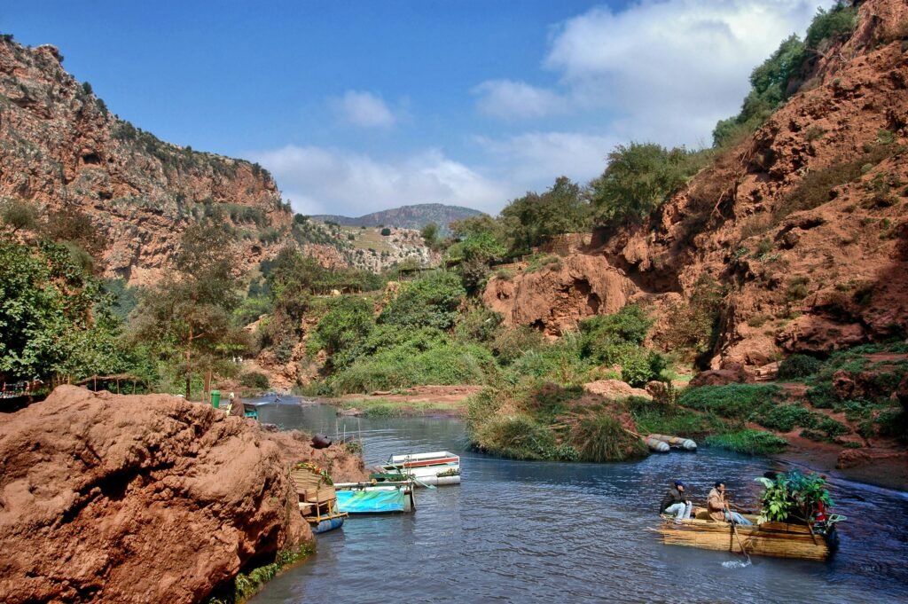 Beautiful river flowing through a canyon in Béni Mellal, Morocco, with boats on a summer day.