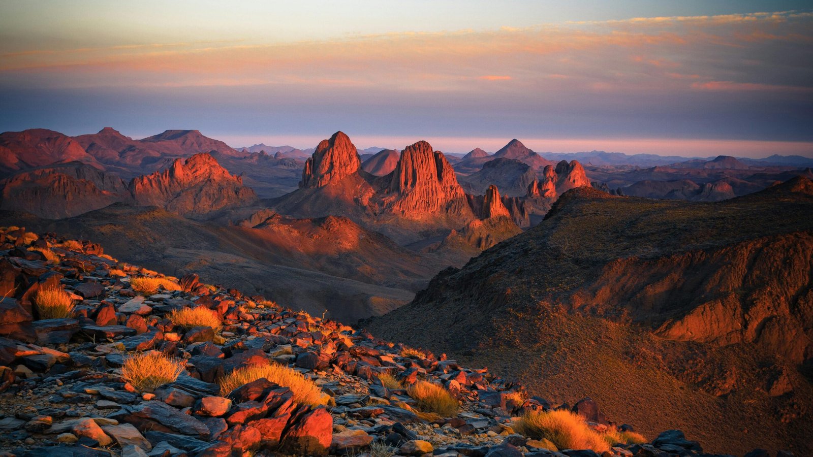 Capture the breathtaking sunset across the rocky terrains of Tamanrasset, Algeria.
