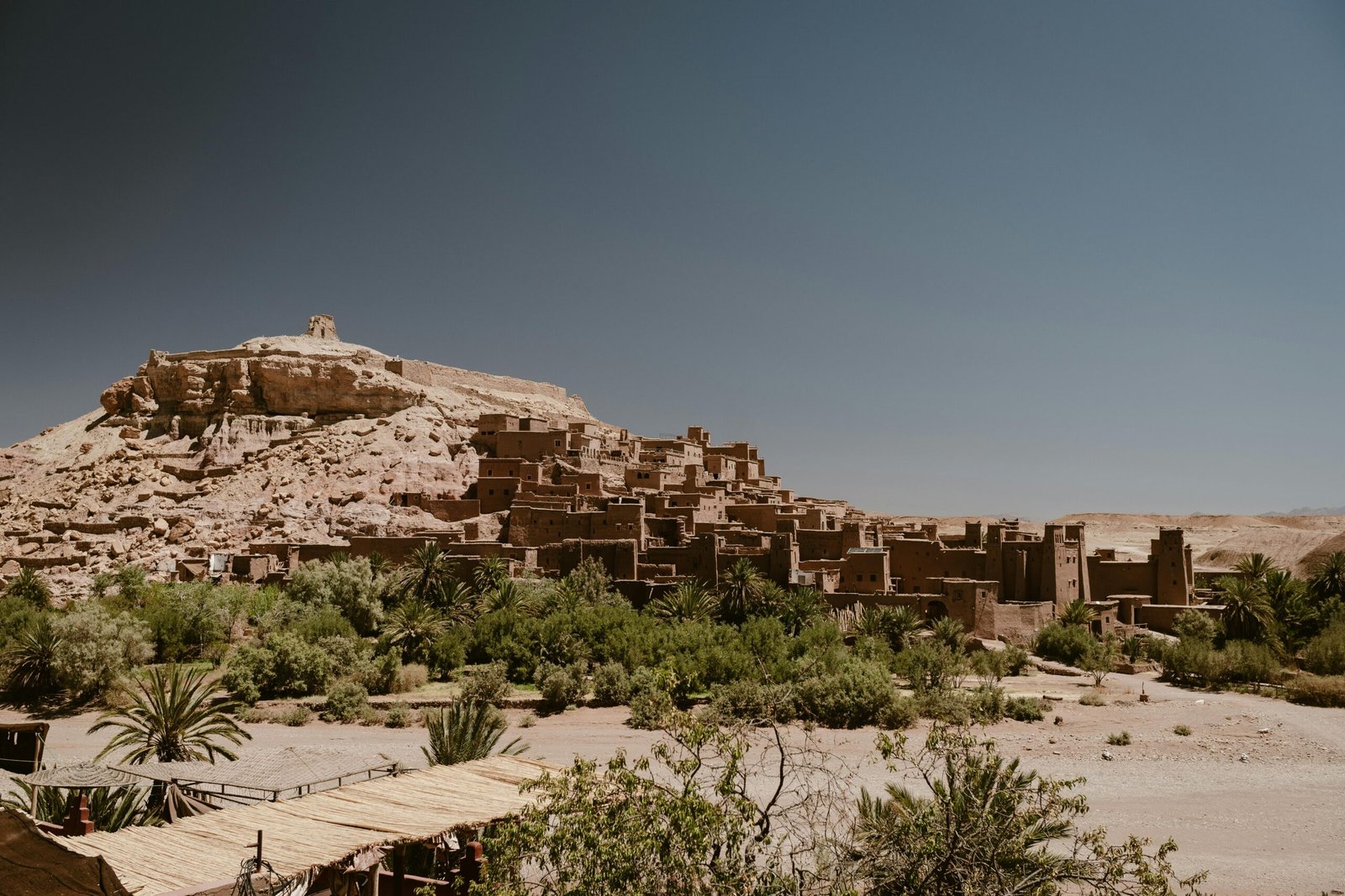 Stunning view of Ksar Ait Ben Haddou in Morocco's Draa-Tafilalet region under a clear blue sky.