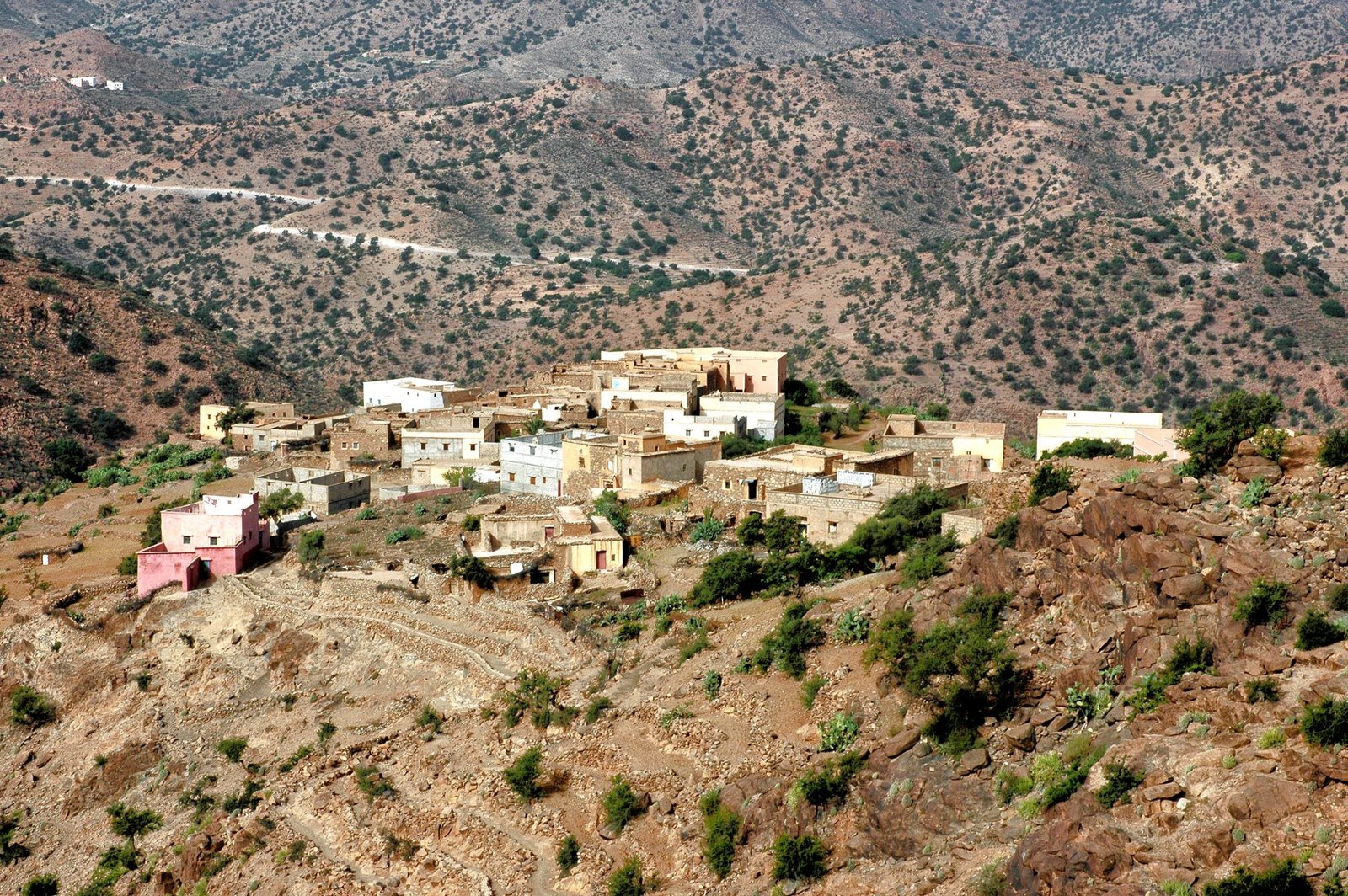 Aerial view of a traditional village nestled in the Tafraoute mountains, Morocco.